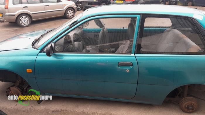 Portier 2Deurs links van een Toyota Starlet (746), Auto-onderdelen, Carrosserie, Deur, Toyota, Gebruikt, 3 maanden garantie