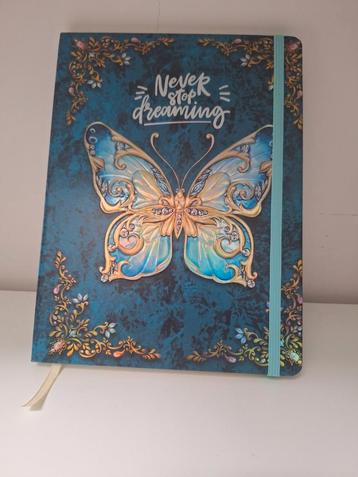 Prachtig notitieboekje blauwe vlinder en gouden details beschikbaar voor biedingen