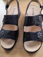 Nieuwe zwarte sandalen, Ophalen