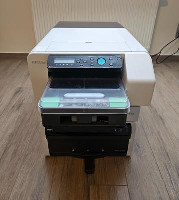 Ricoh Ri 100 Direct-to-Garment (DTG) printer + Rh 100 oven beschikbaar voor biedingen
