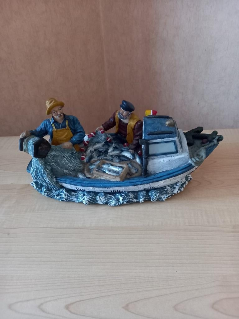 Vissers beeldje, Ophalen