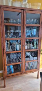 Koloniale boekenkast, Ophalen