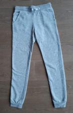 Grijze joggingbroek meisje H&M (2stuks) - maat 164, Enlèvement ou Envoi, Utilisé, H & M, Vêtements de sport ou Maillots de bain