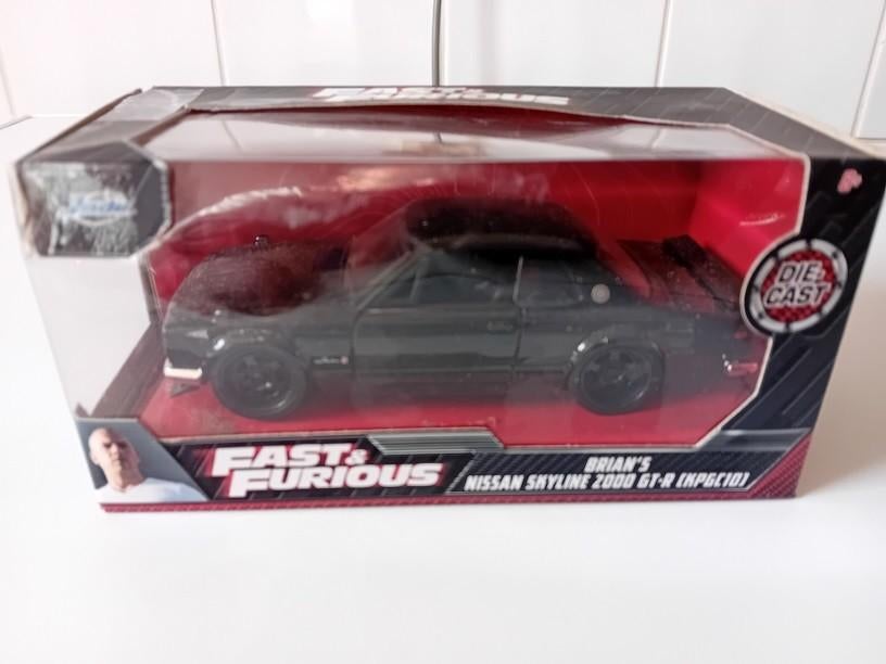 BRIAN'S NISSAN SKYLINE 2000 GT-R (KPGC10) uit FAST & FURIOUS, Hobby & Loisirs créatifs, Voitures miniatures | 1:32, Enlèvement ou Envoi