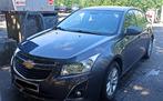 Chevrolet Cruze 1.6 Essence, Autos, Chevrolet, 1200 kg, Boîte manuelle, Noir, 5 portes