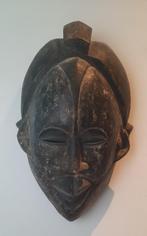 Africaans masker, Ophalen