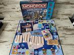 Monopoly wereldeditie here & now Hasbro [s207], Ophalen of Verzenden, Zo goed als nieuw