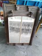 spiegel in gietijzeren dakraam, Ophalen