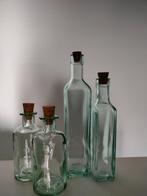 Set met 4 flessen in glas, Huis en Inrichting, Keuken | Servies, Glas, Ophalen of Verzenden, Zo goed als nieuw
