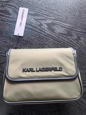 Karl Legerfeld tas beschikbaar voor biedingen
