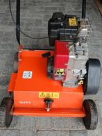 Verticuteermachine., Enlèvement, Essence