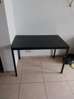 Tafel met donker blad en metalen poten., Ophalen