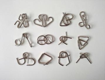 Lot de 12 petits casse-tête en métal beschikbaar voor biedingen