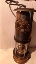 Mijnwerkerslamp, Ophalen, Brons