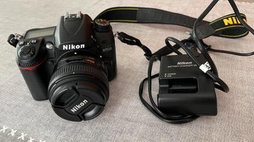 Nikon D7000 + 50 mm lens 1:1.8G + batterijlader beschikbaar voor biedingen