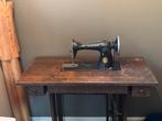 Antieke naaimachine echte singer, Ophalen