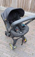 Doona + Isofix + regenhoes (2024), Ophalen, Zo goed als nieuw
