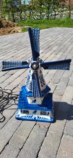 Lampe moulin Delft, Ophalen