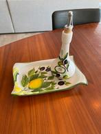 Oliefles met schenkteut, Ophalen