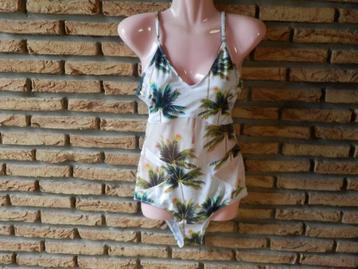 (47)- maillot femme t.38 vert blanc  beschikbaar voor biedingen