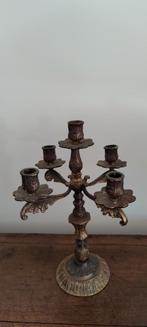 Bronzen kandelaar, Ophalen