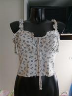 Blauwe top met witte bloemen T 40/42, Kleding | Dames, Topjes, Ophalen of Verzenden, Gedragen, Blauw
