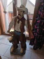 Beeld cowboy met geweer, Ophalen