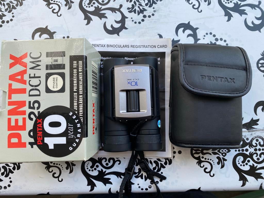 Pentax 10x25 DCF MC, verrekijker *nieuw, Ophalen of Verzenden, Nieuw, Met hoes of tas