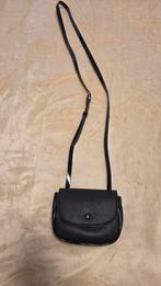 Zwarte handtas sprit, Ophalen