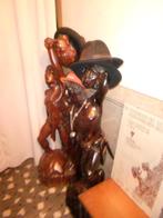 Houten beelden, Ophalen