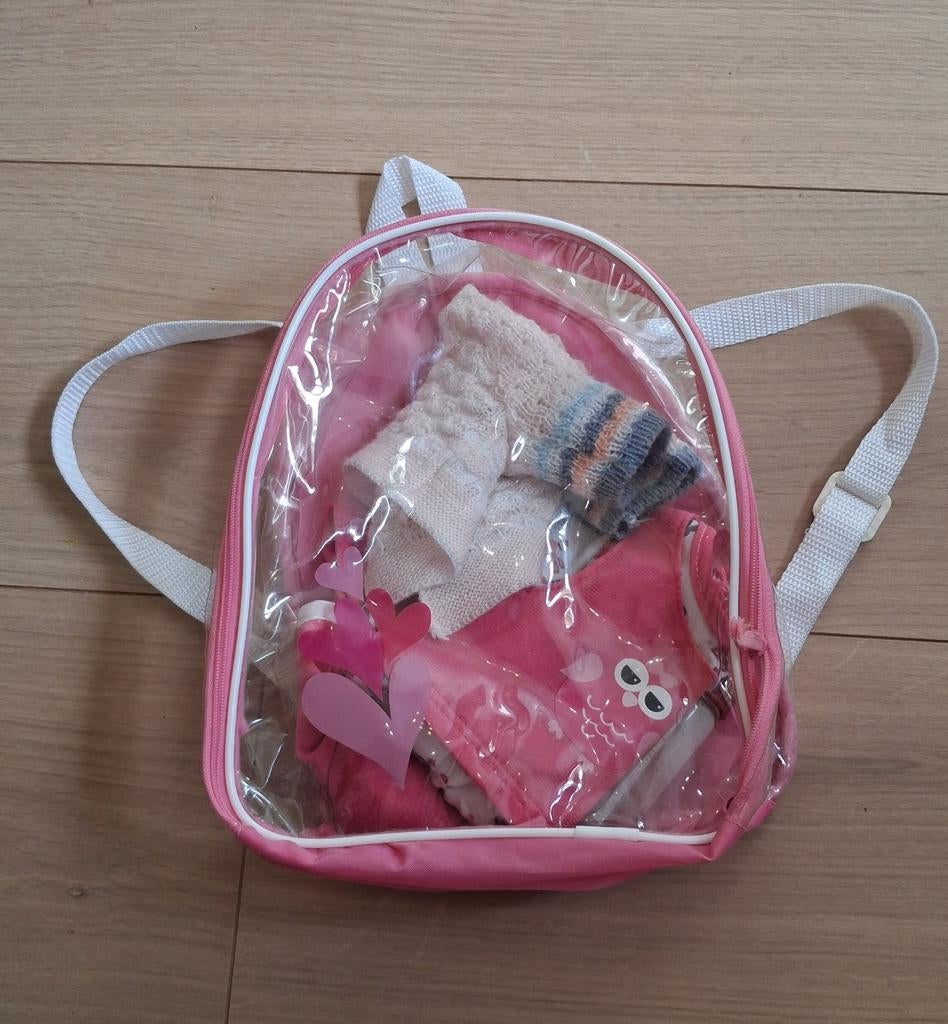 Rugzakje met poppenaccessoires, Ophalen