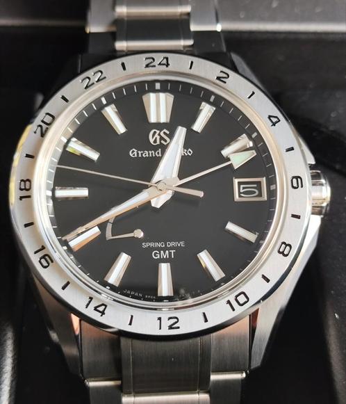 T.K. z.g.a.n. Grand Seiko Evolution 9 GMT Titanium 03-2025, Handtassen en Accessoires, Horloges | Heren, Zo goed als nieuw, Polshorloge