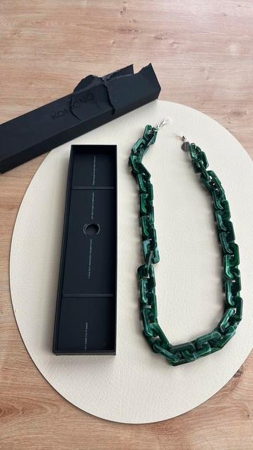 Brilketting groen Komono beschikbaar voor biedingen