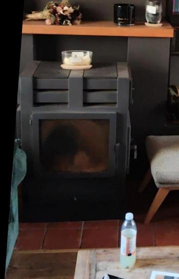 Houtkachel met warmte-elementen bovenzijde. beschikbaar voor biedingen