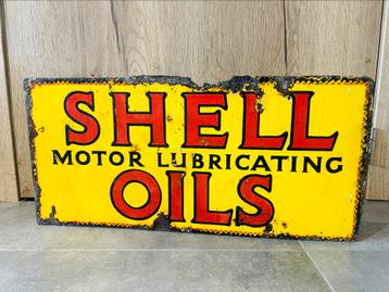 Plaque émaillée réclame bord émail vintage oil Shell huile  disponible aux enchères