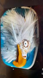 Carnaval masker vogel, Ophalen