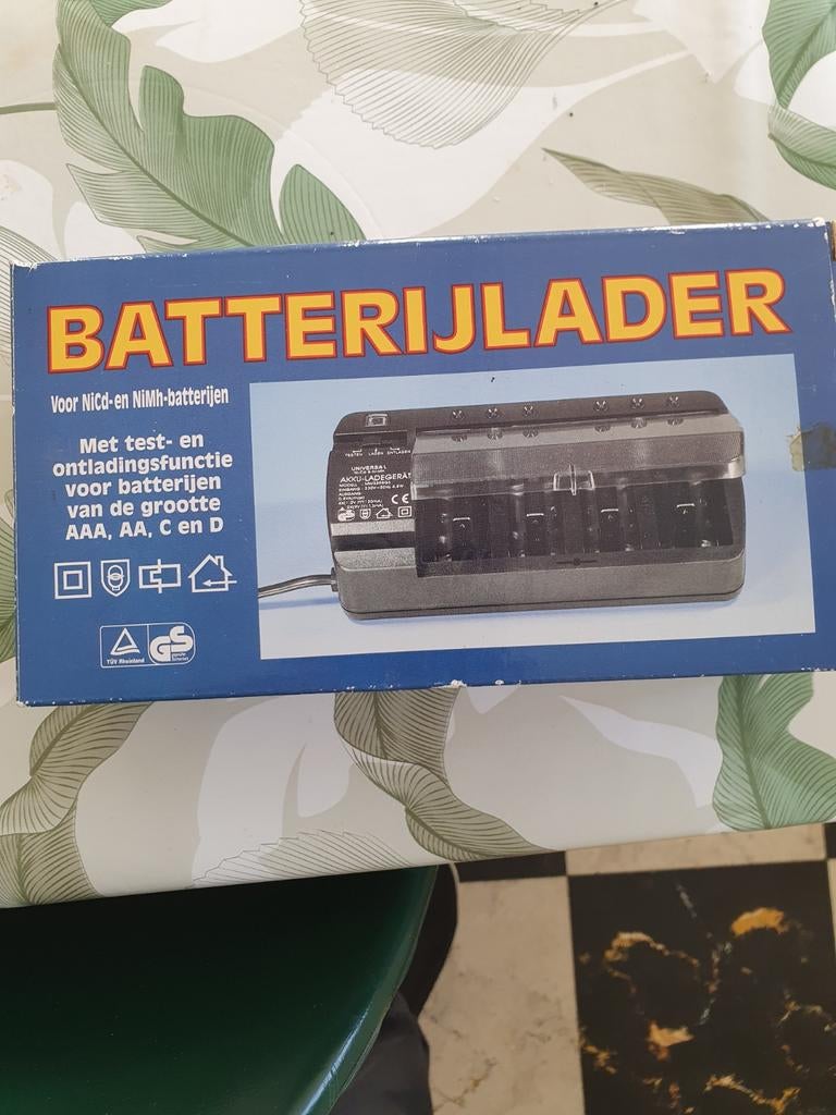 Batterij lader nog nieuw in verpakking, Ophalen of Verzenden