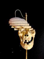 Crâne humain Beauchène sculpté, Enlèvement, Crâne