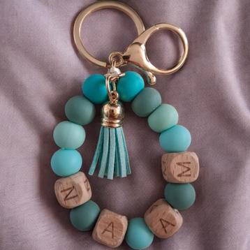 Sleutelhanger turquoise gepersonaliseerd met naam beschikbaar voor biedingen