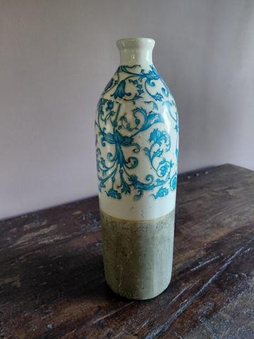De gresse kruik met blauwe  glazuur, Envoi