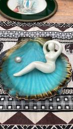 Porseleinen schelp, Ophalen