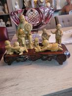 chinees familietafereel in speksteen (1930), Ophalen