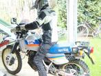 Motorpak gedragen door dame xs, Ophalen