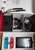 Nintendo Switch rood/blauw + doos + accessoires + 2 spellen, Games en Spelcomputers, Ophalen of Verzenden, Zo goed als nieuw