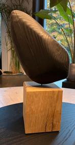 Vol houten sculptuur, Ophalen