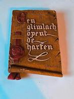 Gipsen wandbord 'Een glimlach opent de harten', Antiek en Kunst, Ophalen of Verzenden