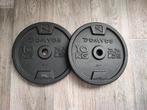 2 x 10kg Domyos disques de musculation. (20kg) (Bon état!), Enlèvement, Comme neuf, Bras, Plaques d'haltères