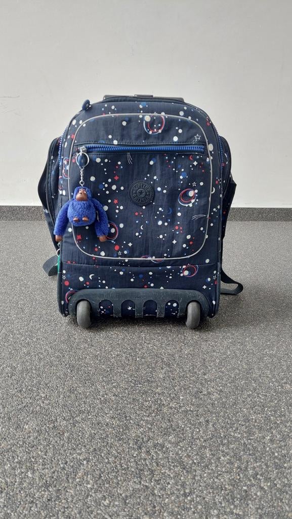 Boekentas van kipling op wieltjes, Ophalen