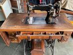 Mooi antiek werkend naaimachine, Enlèvement