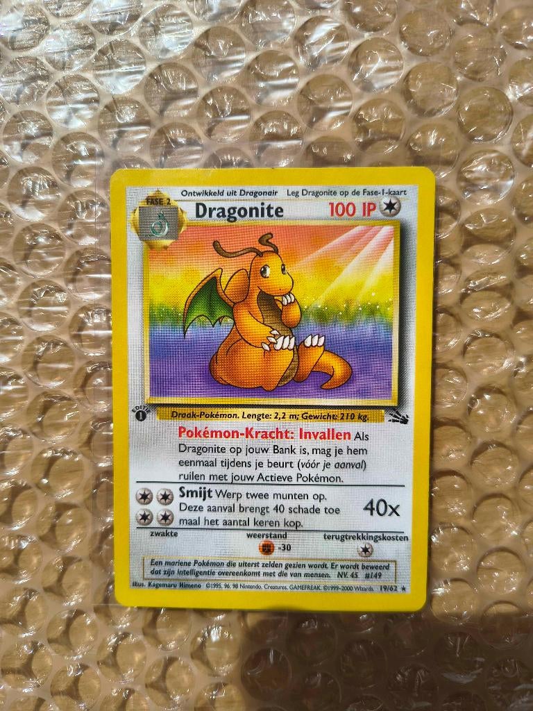 Pokemon Dragonite Nederlands Fossil 1st edition, Ophalen of Verzenden, Gebruikt, Losse kaart